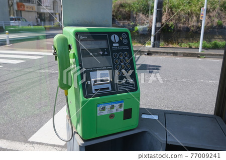 Payphone telephone box green stock photos 77009241