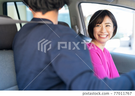 A couple enjoying drive A couple enjoying drive 77011767