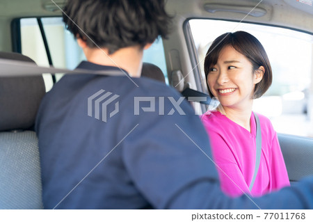 A couple enjoying drive A couple enjoying drive 77011768