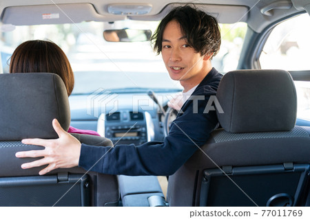 A couple enjoying drive A couple enjoying drive 77011769