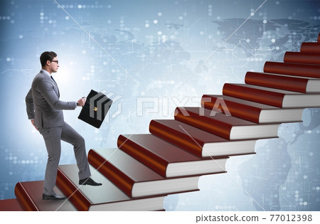 Businessman student climbing the ladder of education books Businessman student climbing the ladder of education books 77012398