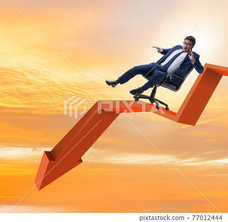 Businessman sliding down on chair in economic crisis concept 77012444