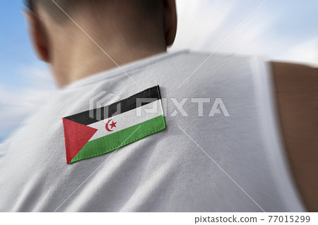The national flag of Sahrawi on the athlete's back The national flag of Sahrawi on the athlete's back 77015299