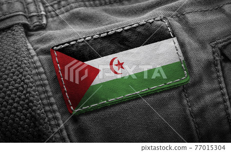 Tag on dark clothing in the form of the flag of the Sahrawi Tag on dark clothing in the form of the flag of the Sahrawi 77015304