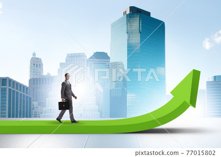 Businessman in economic growth concept 77015802