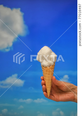 Ice cream cone and Cotton like Clouds 77016497