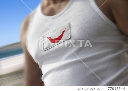 The national flag of Easter Island on the athlete's chest The national flag of Easter Island on the athlete's chest 77017344