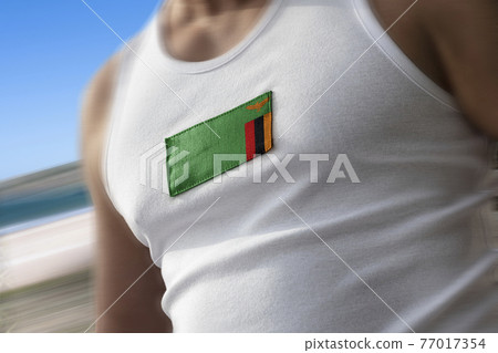 The national flag of Zambia on the athlete's chest The national flag of Zambia on the athlete's chest 77017354