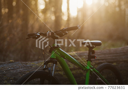 mountain bike at sunset 77023631