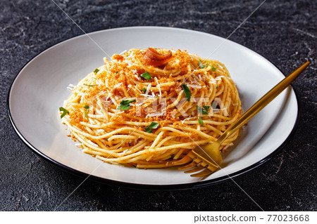 Pasta mollicata with anchovies, top view, close-up 77023668