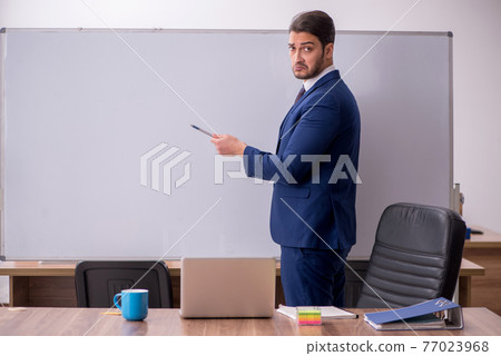 Young handsome employer in teleconference concept Young handsome employer in teleconference concept 77023968