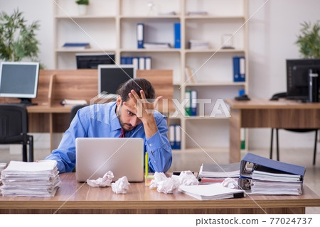 Young male employee in brainstorming concept Young male employee in brainstorming concept 77024737
