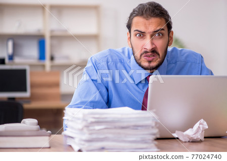 Young male employee in brainstorming concept Young male employee in brainstorming concept 77024740