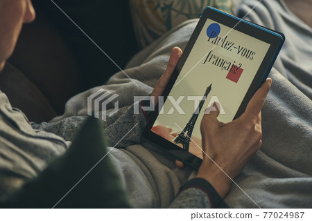 man watches tablet that reads do you speak french man watches tablet that reads do you speak french 77024987
