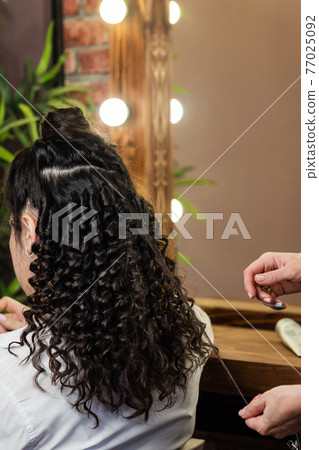 Hair styling process. Afro curls Hair styling process. Afro curls 77025092