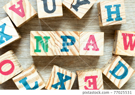 Alphabet letter block in word NPA (Abbreviation of Non performing assets or Nasopharyngeal airway) with another on wood background Alphabet letter block in word NPA (Abbreviation of Non performing assets or Nasopharyngeal airway) with another on wood background 77025531