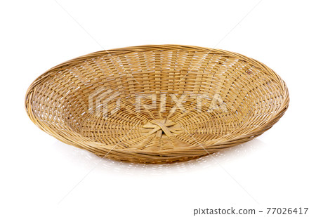 Empty wicker tray isolated on white background Empty wicker tray isolated on white background 77026417