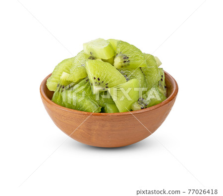 Fresh Kiwi in bowl on white background Fresh Kiwi in bowl on white background 77026418