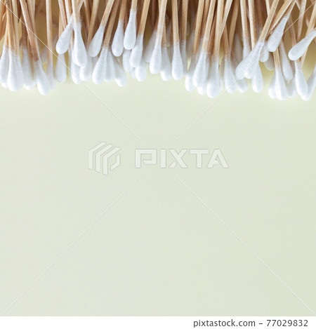 Heap of bamboo cotton swabs or buds top view on beige background Heap of bamboo cotton swabs or buds top view on beige background 77029832