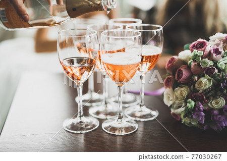 Luxury glasses with champagne on the table Luxury glasses with champagne on the table 77030267