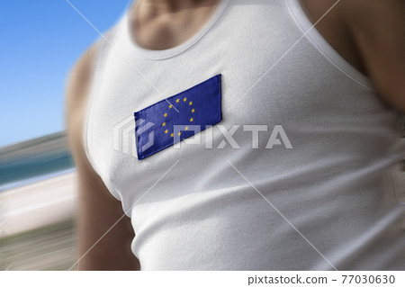 The national flag of European Union on the athlete's chest The national flag of European Union on the athlete's chest 77030630
