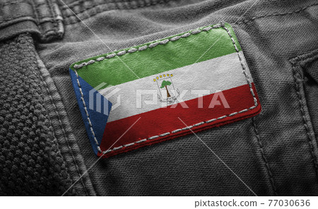Tag on dark clothing in the form of the flag of the Equatorial Guinea Tag on dark clothing in the form of the flag of the Equatorial Guinea 77030636