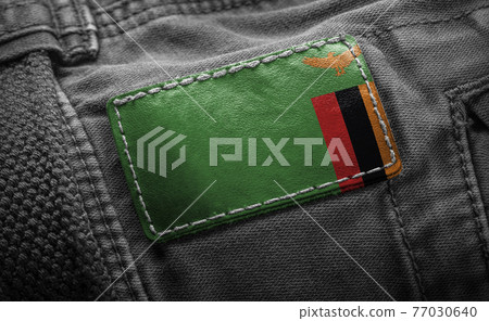 Tag on dark clothing in the form of the flag of the Zambia Tag on dark clothing in the form of the flag of the Zambia 77030640