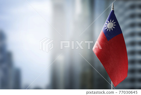 A small flag of Taiwan on the background of a blurred background A small flag of Taiwan on the background of a blurred background 77030645
