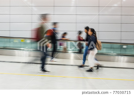 Motion blur of people walking Motion blur of people walking 77030715