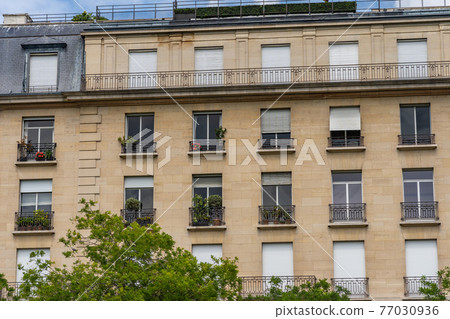 Typical window and balcony of Parisian apartment Typical window and balcony of Parisian apartment 77030936