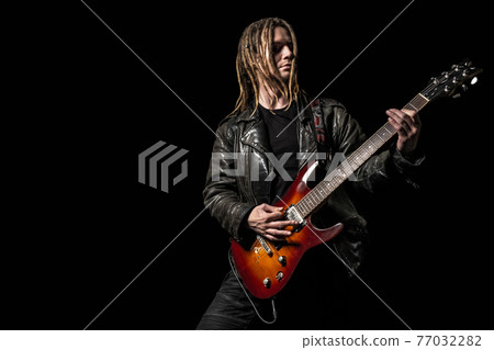 Musician playing electric guitar Musician playing electric guitar 77032282