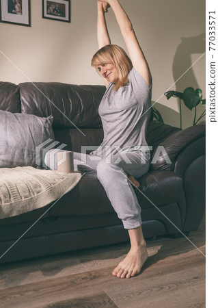 Woman stretching hands Woman stretching hands 77033571