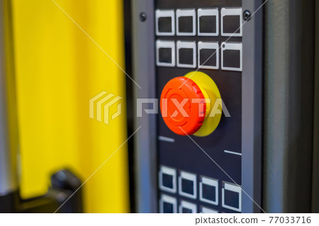 Machine control panel with push buttons and switches at factory Machine control panel with push buttons and switches at factory 77033716