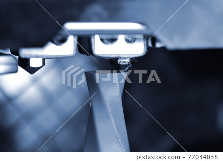 Modern 3D printer printing figure close-up. Automatic three dimensional 77034038