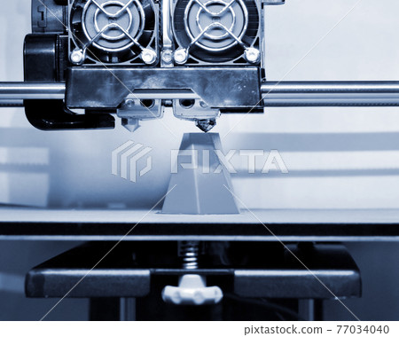 Modern 3D printer printing figure close-up. Automatic three dimensional 77034040