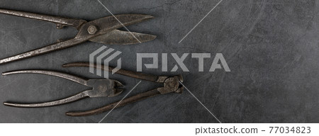Set of different tools on grunge background. Set of different tools on grunge background. 77034823