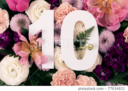 Layout with colorful flowers, leaves and number ten.  77034831