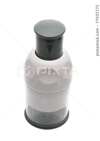 Manual kitchen chopper of fruits and vegetables on a white background 77035772