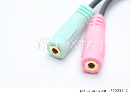 Audio video adapter cable with trrs jack to trs connectors on a white background Audio video adapter cable with trrs jack to trs connectors on a white background 77035842