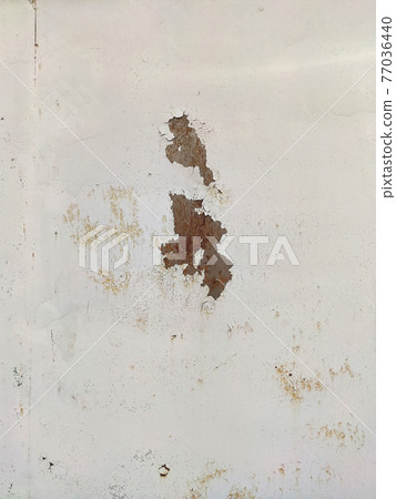 Corroded metal background. Rusty metal background with streaks of rust. Rust stains. Rystycorrosion. 77036440