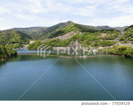 Dam reservoir and natural landscape Dam reservoir and natural landscape 77039529