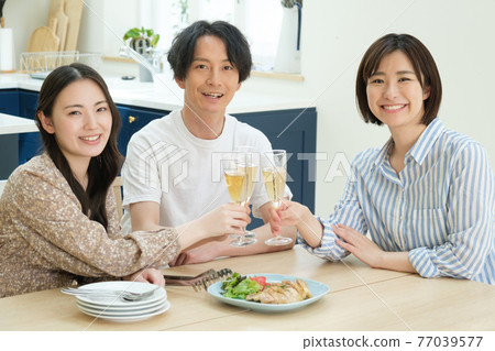 People having a home party at home People having a home party at home 77039577