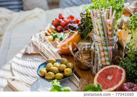 Close up table serve vegetarian food and drink preparing for birthday party or celebrating holiday Close up table serve vegetarian food and drink preparing for birthday party or celebrating holiday 77041080