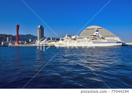 April 2021 Passenger ship "Pacific Venus" moored at the jetty in Kobe Port in the blue sky 77044294