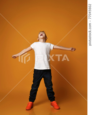 Talented kid, teenager, schoolboy in blue jeans 77045602