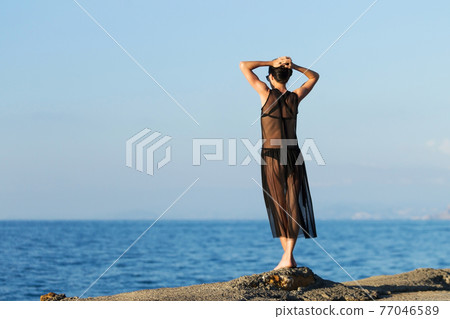 young slim gitl looking to the ocean young slim gitl looking to the ocean 77046589