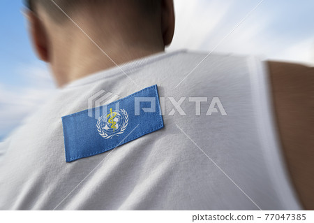The national flag of World Health Organization WHO on the athlete's back 77047385