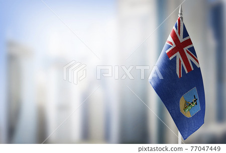 A small flag of Montserrat on the background of a blurred background 77047449