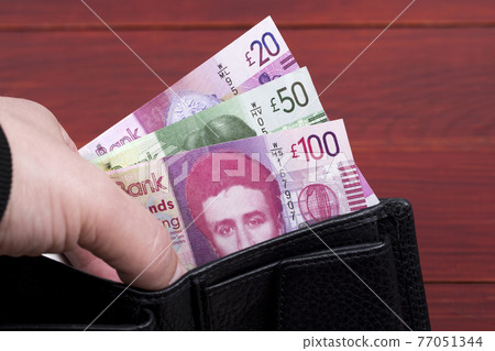 Scottish money - Pounds in a black wallet Scottish money - Pounds in a black wallet 77051344