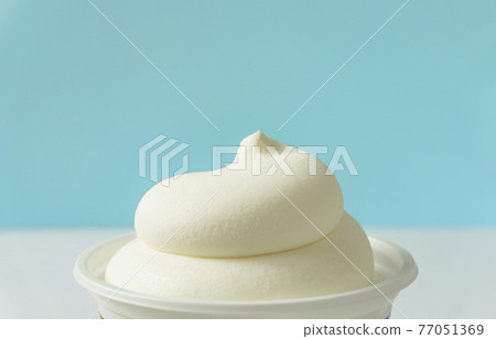 A cup of ice cream. Soft cream A cup of ice cream. Soft cream 77051369